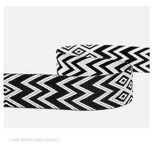 Detail of bohemian black and white geometric woven strap with wave and diamond patterns