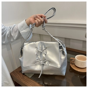 Chic silver pearlescent tote bag with drawstring detail and metallic PU leather finish