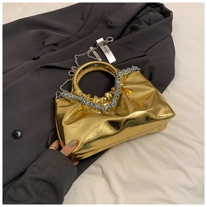 Metallic gold pleated handbag with circular metal handle and silver chain strap
