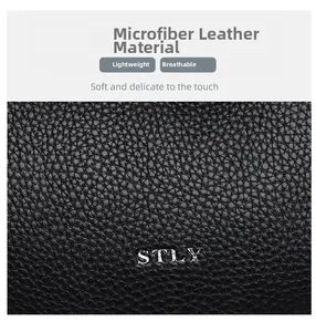 Close-up of black micro-fiber leather with STLY silver logo and grain texture