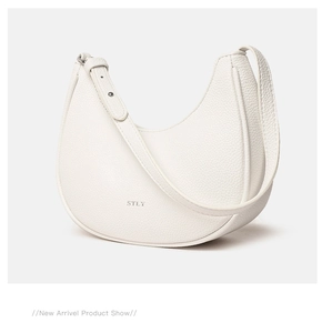 Detail of white lychee leather underarm bag with silver STLY logo and adjustable buckle