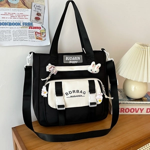 Classic black and white nylon crossbody tote bag with cute rabbit badge and buckle pocket