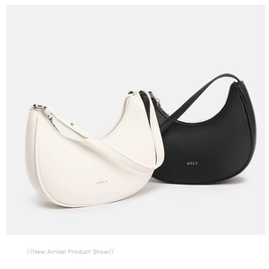 Detailed macro view of minimalist soft hobo bags in black and white pebble leather