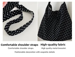 Detail of soft fabric handles and polka dot pattern on a canvas tote bag