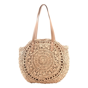 Detailed macro view of the spiral straw weave and brown faux leather handle stitching