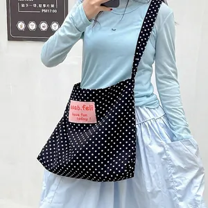 Retro black canvas crossbody bag with white polka dots and large capacity design