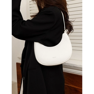 Minimalist white leather crescent underarm bag with silver logo in lychee texture