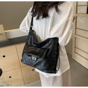 Hobo shoulder bag featuring black quilted leather and a silver metallic twist-lock