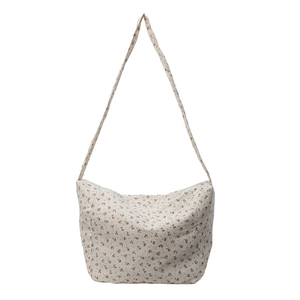 Floral crossbody bag in cream canvas with red flower patterns and moon shape