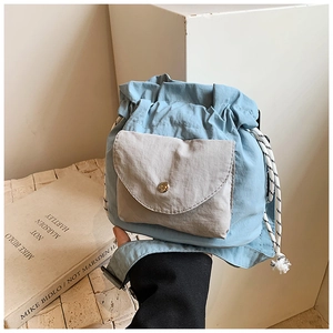 Minimalist light blue oxford fabric crossbody bucket bag with grey flap and wide strap
