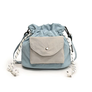 Minimalist light blue oxford fabric drawstring bucket bag with fashion label