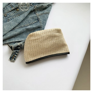 Minimalist straw woven handbag with black PU leather trim and a natural stylish texture