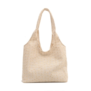 Chic off-white lace embroidered tote bag with floral patterns and a wide shoulder strap
