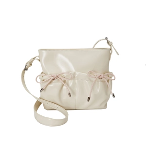 Chic cream white PU leather crossbody bag with pink bow accents and shiny finish