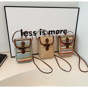 Straw crossbody bags in three summer colors with brown leather flaps and long straps