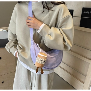 Light purple crescent nylon crossbody bag with a cute coffee cup plush charm detail