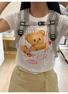 Detailed close-up of Butterbear Cupid print on a premium white cotton short sleeve T-shirt