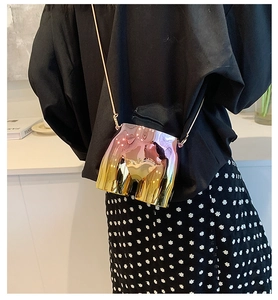 Detail of creative rainbow gradient body shaped crossbody bag with gold chain strap