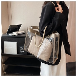 Detail view of transparent PVC tote bag with inner canvas pouch and rope handles