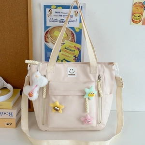 Minimalist beige nylon tote bag with multi-pockets and cute plush star charms