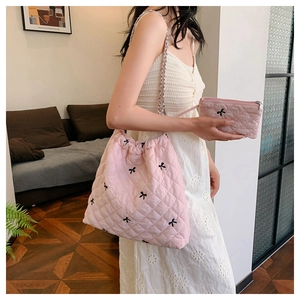 Pink quilted bag set with black bow embroidery and silver chain strap details