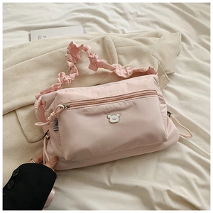 Pink nylon crossbody bag for women with ruched shoulder strap and cute bear logo