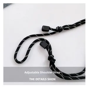 Detail of adjustable black woven shoulder strap with white dot accents and buckle