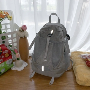 Grey waterproof nylon backpack with reflective strips and functional mesh pockets