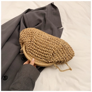 Minimalist straw woven half-moon crossbody bag with golden chain and woven handle