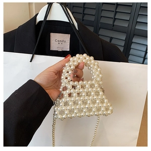 Elegant handmade pearl woven handbag with top handle and crossbody strap for women