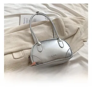 Close-up of the metallic silver Boston bag made of high-quality PU leather with neat stitching
