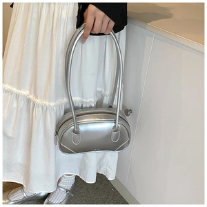 Close-up of metallic silver PU leather Boston bag with dual handles and smooth zipper finish