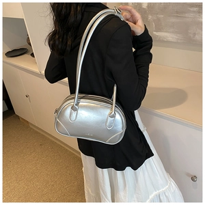 Detail of silver metallic PU shoulder bag showing textured finish and sleek twin handles