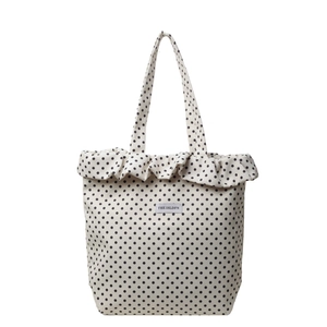 Minimalist white polka dot tote bag with ruffle edge and sturdy canvas handles