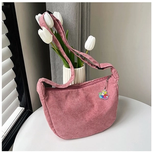 Pink corduroy half-moon crossbody bag with cute bear charm and adjustable strap