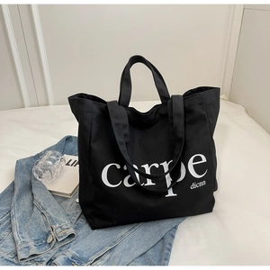 Minimalist black canvas tote bag with carpe print, large capacity casual shoulder bag style