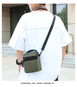 Close-up of olive green waterproof oxford bag showing sport logo and nylon strap