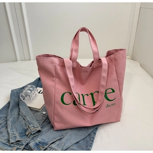 Pink canvas tote bag with green carpe dicnn print and large capacity for daily commute