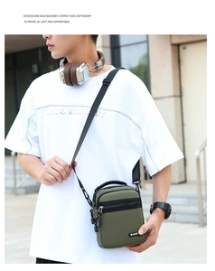 Detail of army green water-resistant oxford shoulder bag with SPORT logo and adjustable strap