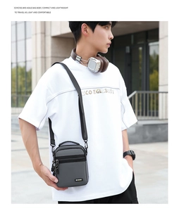 Outdoor shot of a compact grey water-resistant nylon crossbody bag with sport label