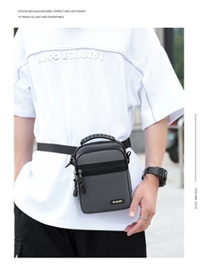 Close-up of a grey water-resistant oxford fabric crossbody bag with sport logo details