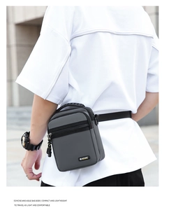 Detail of grey waterproof oxford bag with rubber handle and SPORT logo on strap