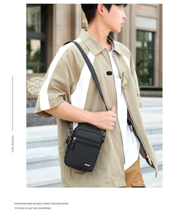 Waterproof oxford fabric crossbody bag shown on model during casual outdoor use