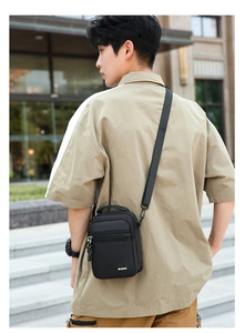 Detail view of water-resistant oxford fabric and Sport Fashion badge on cross-body bag