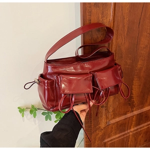 Fashionable burgundy PU leather shoulder bag with multi-pocket design and glossy finish