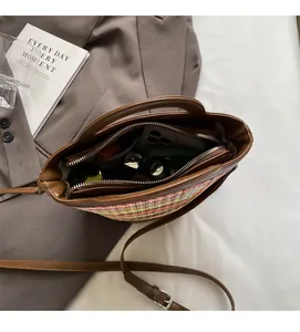 Top view of woven straw shoulder bag showing spacious interior with multi-compartments
