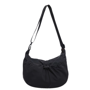 Minimalist black nylon crossbody dumpling bag with adjustable strap and drawstring pleats