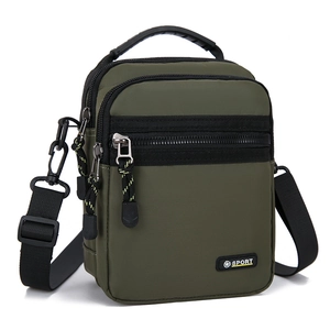 Detail view of water-resistant oxford fabric handbag with multiple zipper pockets