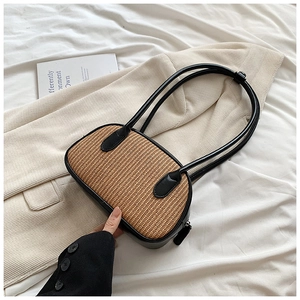 Fashionable straw underarm shoulder bag with black PU leather trim and long strap