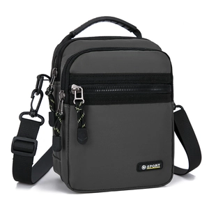 Detailed view of water-resistant dark grey oxford bag with zippers and Sport logo